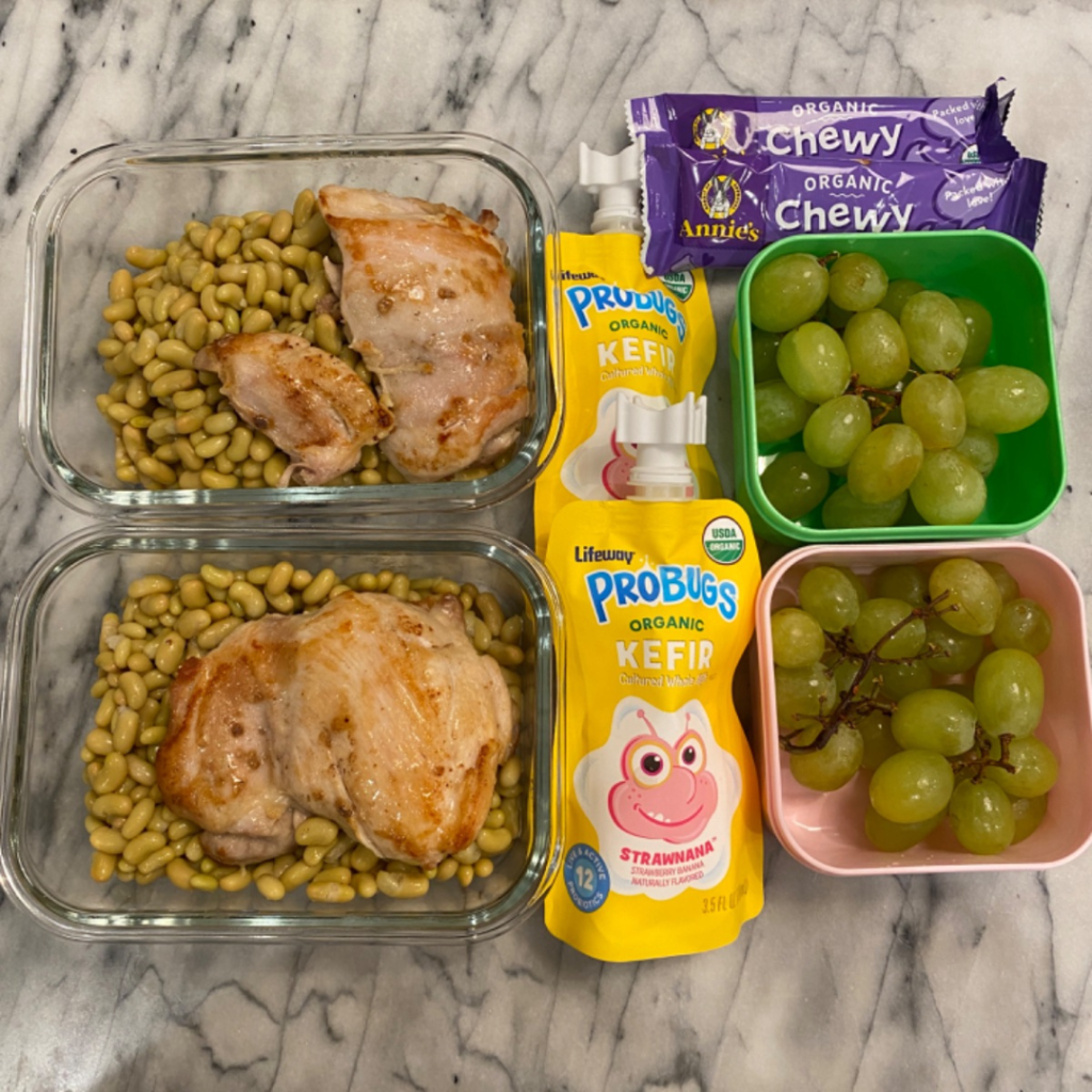  chicken and flageolet beans for kids' lunch in a bento lunchbox with annie's granola bar for snack