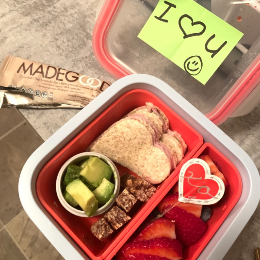 heart-shaped sandwiches for kids' lunch in a bento lunchbox with madegood granola bar for snack